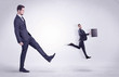 © ra2 studio - Big man kicking little himself out