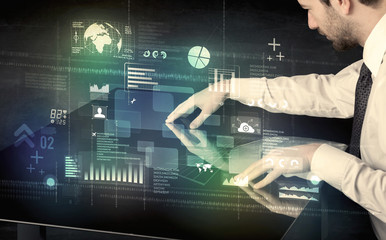 Poster - Businessman touching interactive modern desk with technology icons