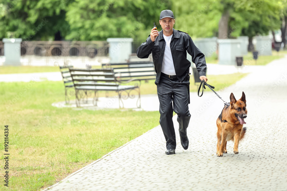 Security guard with dog in park