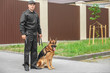© Africa Studio - Security guard with dog, outdoors