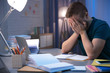 © Africa Studio - Tired student doing homework indoors late at night