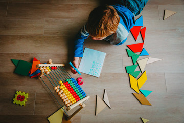 Poster - little boy learn to write and calculate numbers