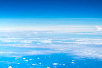 Wall Mural - blue sky and cloud top view from airplane window,nature background.