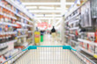 © Kwangmoozaa - Abstract blur supermarket aisle with hardware and tool background with shopping cart