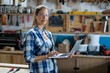 © Wavebreak Media - Female carpenter using laptop