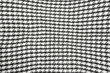 Background texture, pattern. Scarf wool like Yasser Arafat. The Palestinian keffiyeh is a gender-neutral checkered black and white scarf that is usually worn around the neck or head.