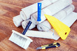 Composition with various tools for home repair and rolls of wallpaper