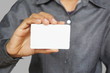 © jantima14 - Man holding white business card