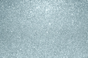 Poster - Slver glitter blur light effect texture particles background. Glittering silver or shining and sparkling snow bokeh lights for modern trendy Christmas festive background design template