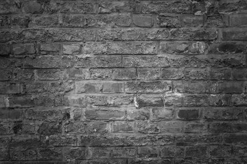 Wall Mural - Old brick wall as background, texture or pattern. Dark wall. Poster or cover. Black and white brick wall.