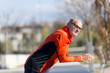 © 2Design - Portrait of athletic senior man leaning on fence
