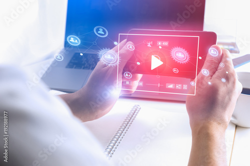 Fotografie, Obraz Man hand using Smartphone to watch Live streaming media online technology