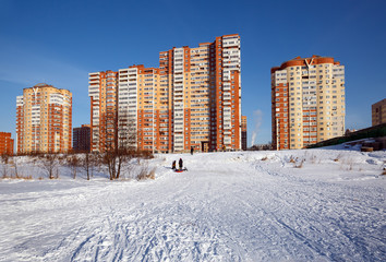 Wall Mural - New residential neighborhood on the bank of the river Pekhorka in winter. City of Balashikha, Moscow region, Russia.