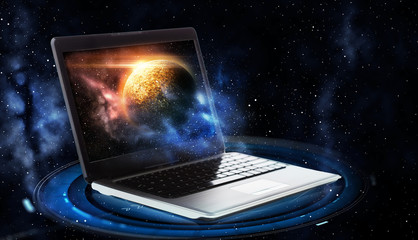 laptop with virtual planet and space hologram