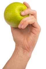 in a hand a green apple isolated on a white background