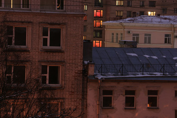 Wall Mural - The lights of the windows of the evening houses