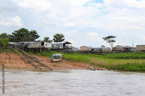 Fotografia, Obraz Amazon river houses on stilts in Amazonas, Brazil