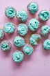© Media Bakery - Cupcakes with turquoise icing and rainbow sprinkles