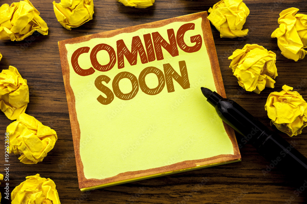 Hand writing text caption showing Coming Soon. Business concept for ...