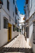 Old typical narrow street in the jewish quarter of Cordoba with