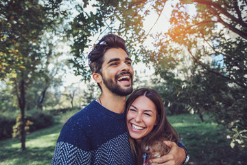 young couple in love having fun and enjoying the beautiful nature