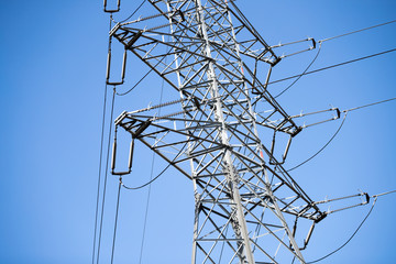 Picture of transmission line tower on blue sky