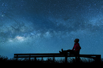 Wall Mural - girl watching the stars in night sky