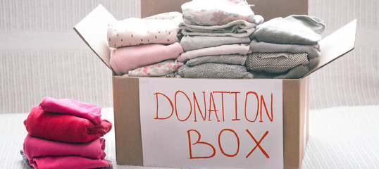 Wall Mural - Box with clothes for charity, concept of social projects