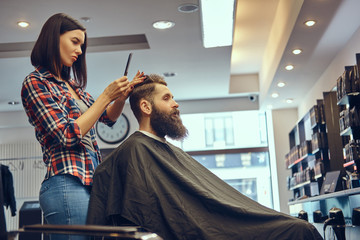 Handsome bearded man in the barbershop.