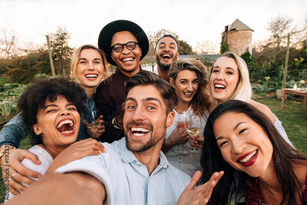 Friends making a selfie together at party