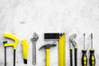 © 9dreamstudio - Various repair tools. Must-have for men. Equipment for building. Repair tool kit. Grey background top view pattern copy space