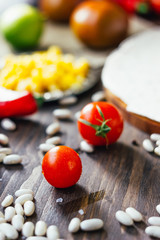 Poster - Red ripe Cherry tomatoes on a wooden table