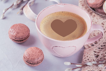 Wall Mural - Pink coffee mug with sweet pastel french macaroons and pussy willow