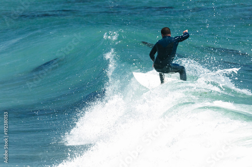 Fotografía Surfer in California surfs large wave in beautiful blue water at beach