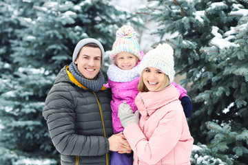 Wall Mural - Portrait of happy family in winter park