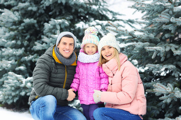 Wall Mural - Portrait of happy family in winter park