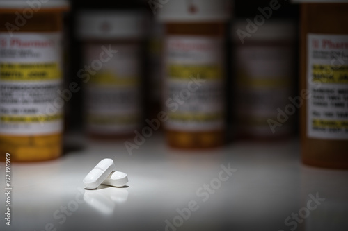 Fotomural Hydrocodone Pills and Prescription Bottles Under Spot Light.