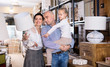© JackF - Happy family is choosing new lamp for home in the furniture store.