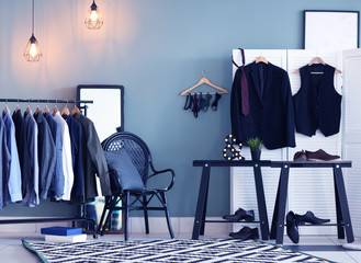 Wall Mural - Dressing room interior with clothes on rack. Fashionable wardrobe