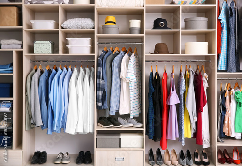 Fotomural Big wardrobe with different clothes for dressing room
