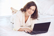 © elenavolf - Work at home. Black notebook. Beautiful girl. White background