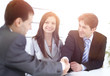 © ASDF - handshake business partners in the workplace