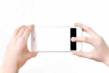 Wall Mural - Mock-up of making photo on a smartphone - Mock-up of making photo on a smartphone - woman's hands holding mobile phone and touching screen isolated on white background