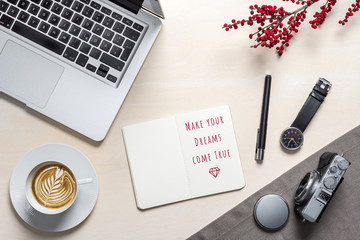 Wall Mural - Make your dreams come true written on notepad in office