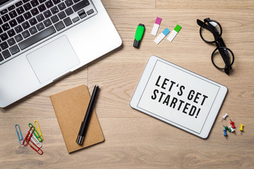 Wall Mural - Let's get started written on tablet lying on desk as flatlay