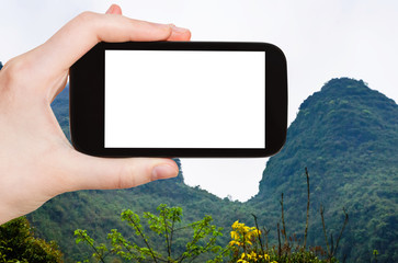 Wall Mural - tourist photograps green karst peaks in Yangshuo