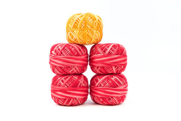 Wall Mural - Five sewing threads in a row on a white background. Red and yellow threads