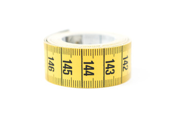 Yellow measuring tape. Sewing and tailoring accessories.