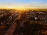 Fototapeta Do pokoju - Aerial view of sunset on a small town