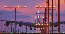 Jumbo Jet Airplane Plane Landing In Airport In Los Angeles At Sunset. 4K UHD